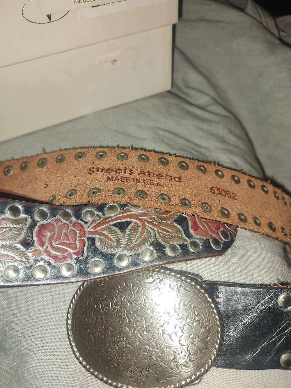 Leather strap close-up with stamped text